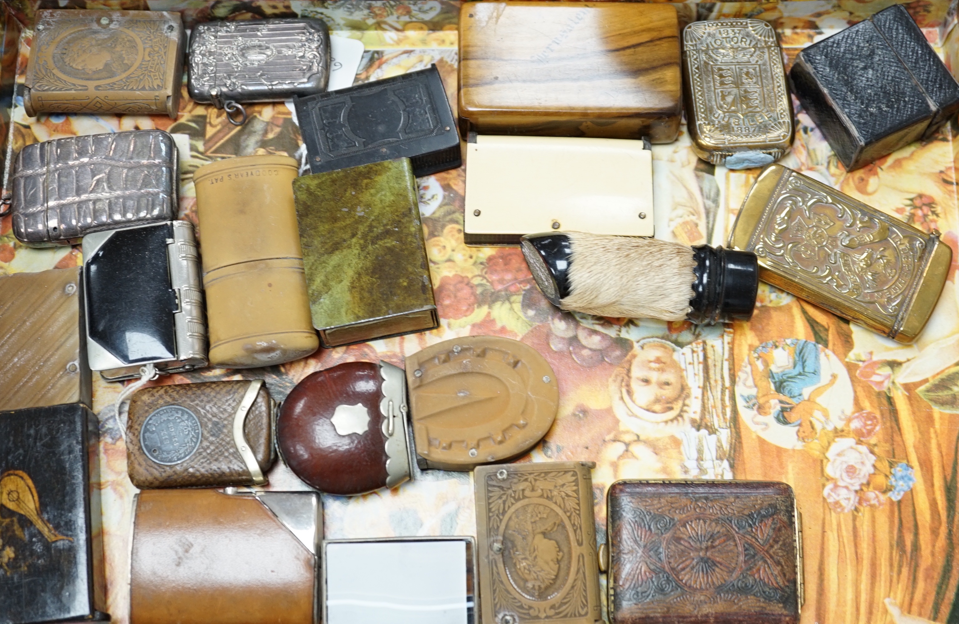 A collection of Victorian and later vestas and matchbox holders, some commemorative